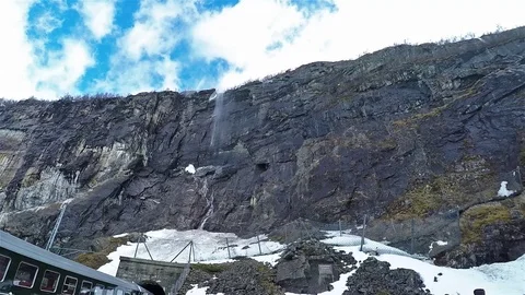 Mountain view with waterfall kjosfossen on path with flamsbana in Norway Stock Footage 91035738