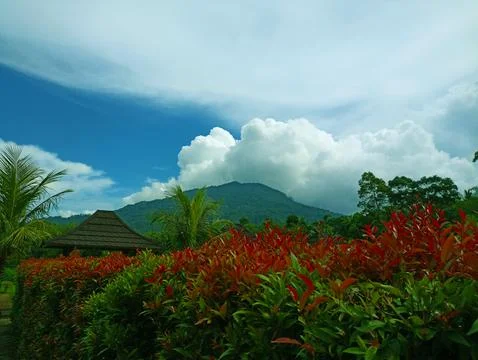 Mountain view with white clouds on a sunny day Stock Photos