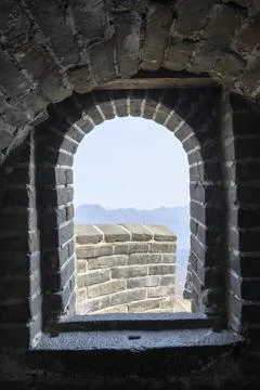 Mountain view from the window of the tower of Great Wall of China in Mutianyu Stock Photos