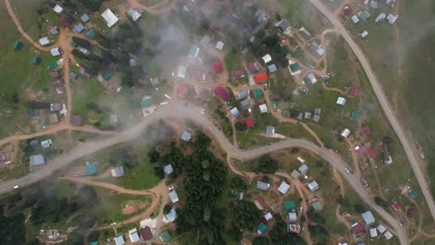 Mountain village from clouds above Video stock 221770034