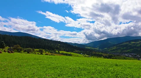 Mountain village in a forest and cloudy sky. 4K. FULL HD, 4096x2304. Stock-Footage 41574416