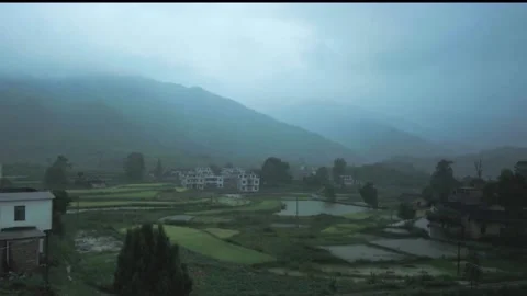 Mountain village in the rain Stock Footage 235111431