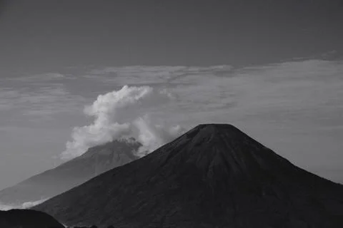 A mountain with a volcano on top Stock Photos
