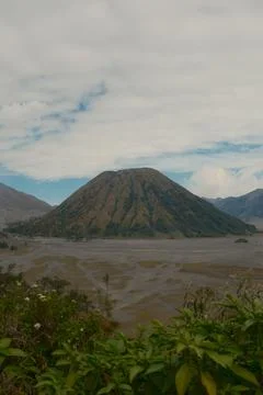 A mountain with a volcano on top Stock Photos