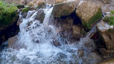 Mountain water flowing between the rocks Stock Footage 171419607