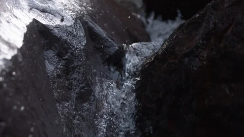 Mountain water pouring over rocks as spring melts snow in Chile. Stock Footage 86879340