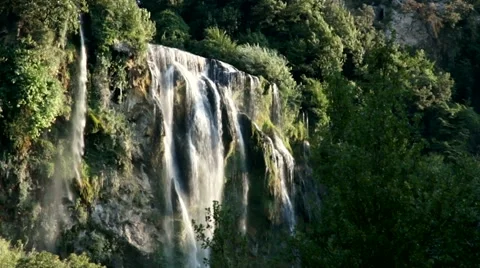 Mountain waterfall among greenery Stock Footage 56566206