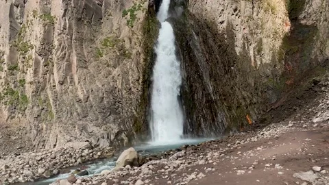 Mountain waterfall between rocks Stock Footage 154665417