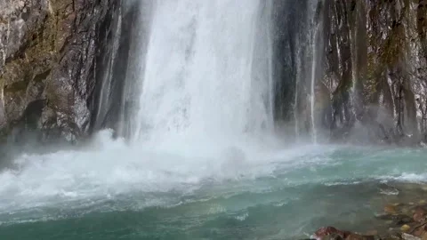 Mountain waterfall between rocks Stock Footage 154665430
