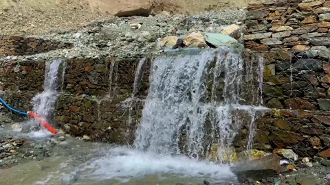 Mountain Waterfall Cascading Over Rocks in Ladakh, India. Stock Footage 338224577