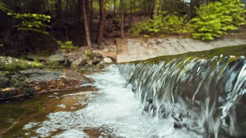 Mountain Waterfall Cascading Over Stone Ledge Video stock 308731116