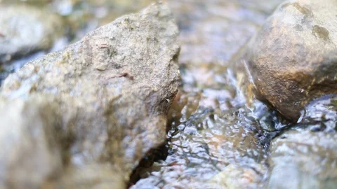 Mountain waterfall Close up, stream of water falling over stones and rocks Stock Footage 127620587