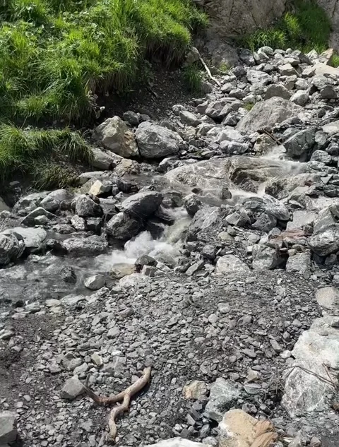Mountain Waterfall Feeding Turquoise Alpine Lake Video stock 340870184
