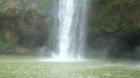 Mountain waterfall flowing clear through the rocks Stock Footage 283701976