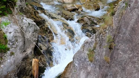 Mountain waterfall flowing on the rocks 스톡 동영상 112895334