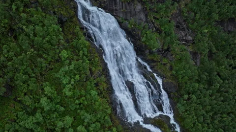 Mountain waterfall flowing through forest at Flesefossen, Brattlandsdalen. Stock Footage 328132697