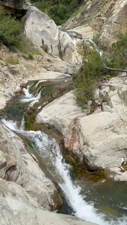 Mountain waterfall flowing through rocky canyon stream in California Stock Footage 316760958
