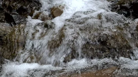 Mountain waterfall that flows fast and clear Stock Footage 297887730
