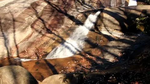 Mountain waterfall over rocks Stock Footage 8972143
