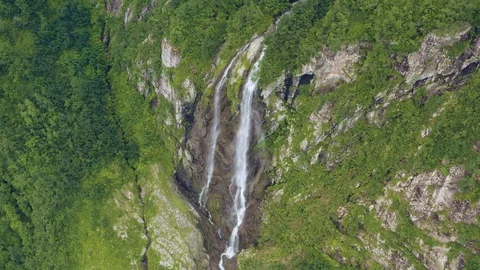 Mountain Waterfall Polikar. The Flow of Water Falls from a Cliff Overgrown with Stock Footage 112085160