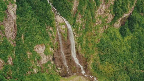 Mountain Waterfall Polikar. The Flow of Water Falls from a Cliff Overgrown with Stock Footage 112087133