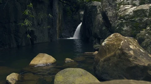 Mountain waterfall in rainforest. Stream water from waterfall flowing on large Stock Footage 93512780
