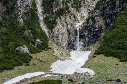 Mountain waterfall snow Stock Photos