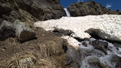 Mountain waterfall view with a melting snow Stock Footage 90492270