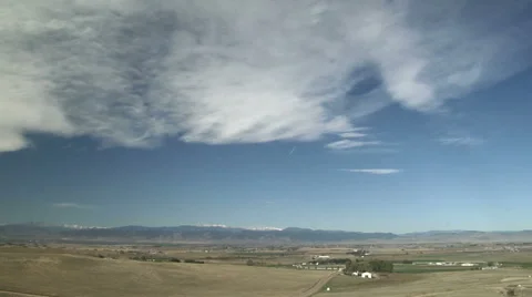 Mountain Wave Clouds and Contrails Stock Footage 54745322