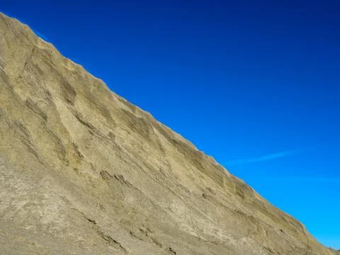 Mountain of white sand. Stock Photos
