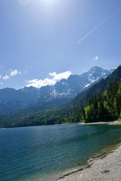 Mountain Wilderness River Through Forested Valley Landscape 写真素材
