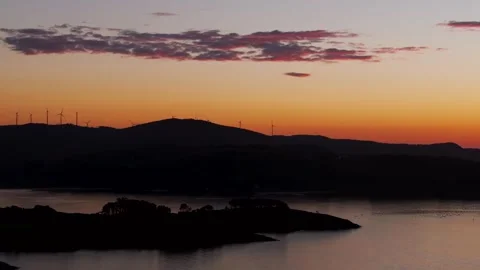 Mountain With Wind Turbines During Sunset With Orange Sky Video stock 295935417