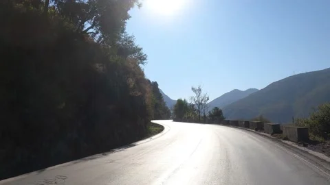 Mountain winding idyllic road Stock Footage 204965043