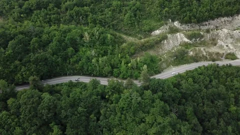 Mountain winding zig zag road. Top aerial view: cars driving on road from above. Stock Footage 132209613