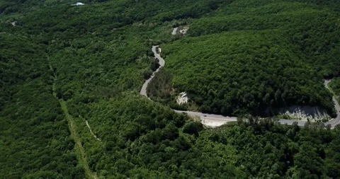 Mountain winding zig zag road. Top aerial view: cars driving on road from above. Stock Footage 132211671