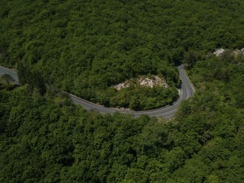 Mountain winding zig zag road. Top aerial view: cars driving on road from above. 스톡 사진