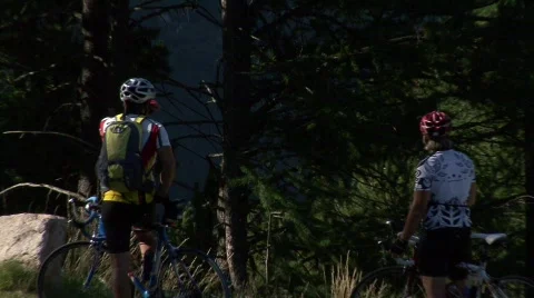 Mountainbikers in Front Of Glacier 스톡 동영상 502867