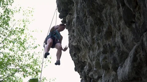 Mountaineer climbs the mountain Stock Footage 98028580