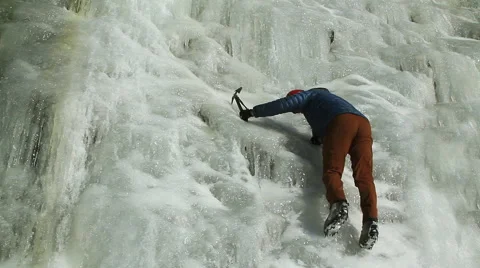 Mountaineer Climbs Vertical Wall of Solid Ice Stock Footage 46690810