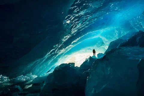 Mountaineer Exploring Massive Ice Cave In Banff National Park Stock Photos