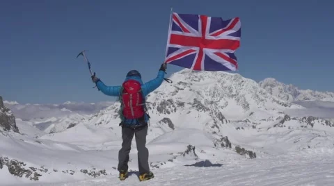 Mountaineer flying British Flag 库存影片 59189917
