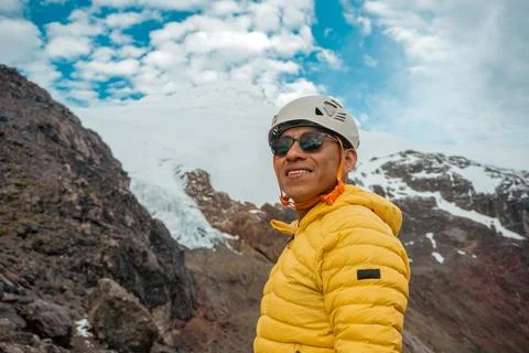 Mountaineer looking at the camera and in the background the cayambe volcano Stock Photos
