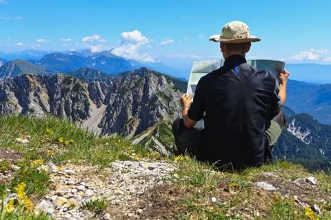 Mountaineer using map and compass Stock Photos