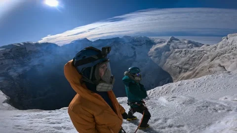 Mountaineers exploring a dangerous active volcano crater Video stock 335498186