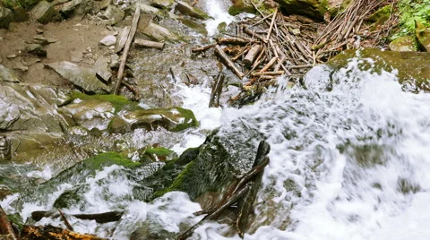 Mountainl waterfall, stream with fallen trees top view . 4K 3840x2160.  Stockbeeldmateriaal 53241829