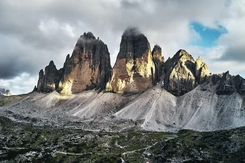 Mountainous landscape with clouds in Three Peaks Nature Park in Italian dolomite Stock Photos