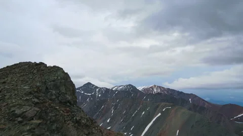 Mountainous landscape in cloudy weather. Drone video. Stock Footage 245619748
