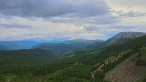 Mountainous landscape in cloudy weather. Drone video. Stock Footage 245619873