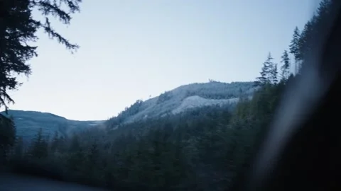 Mountainous Landscape Covered In Snow Seen From A Driving Car - POV Stock Footage 333493666
