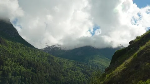 The mountainous landscape mixed terrain, forest, rocks, snow Stock Footage 342713881
